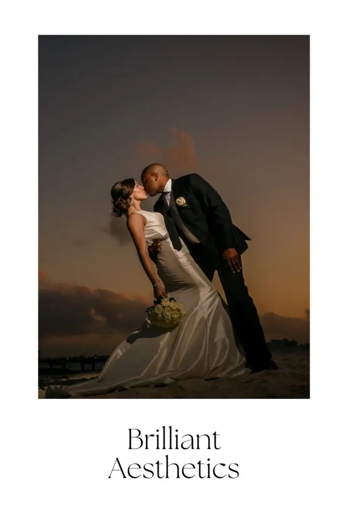 Sunset beach wedding portrait of bride and groom in CancĂșn