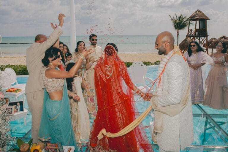 Guests gathered around Kishory and Kyle during their Indian wedding ceremony.