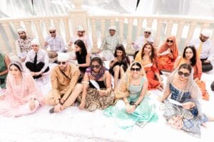 Wedding guests seated together at the outdoor Sikh ceremony at Barcelo Riviera Maya.