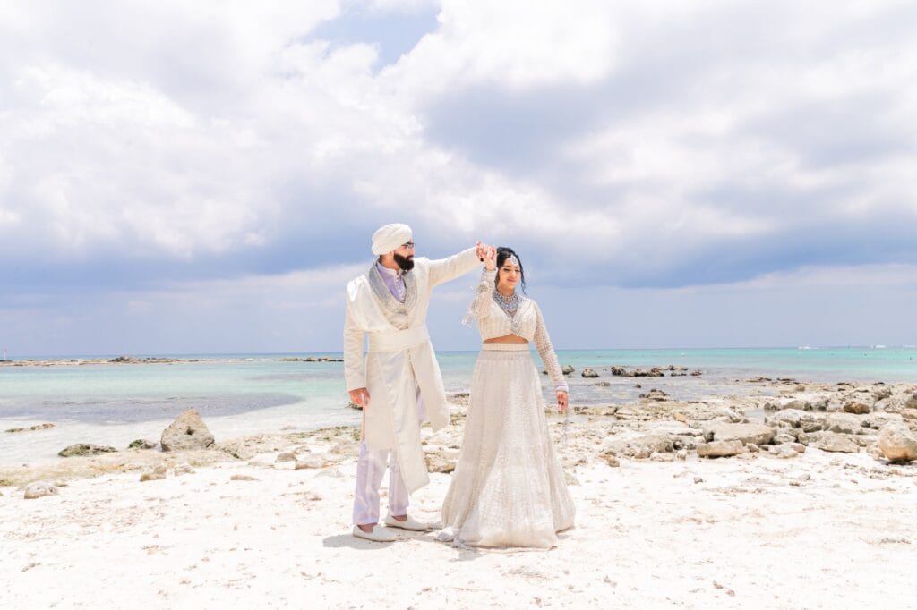 Nusaibah and Jai together beside the turquoise Caribbean Sea at Barcelo Riviera Maya.