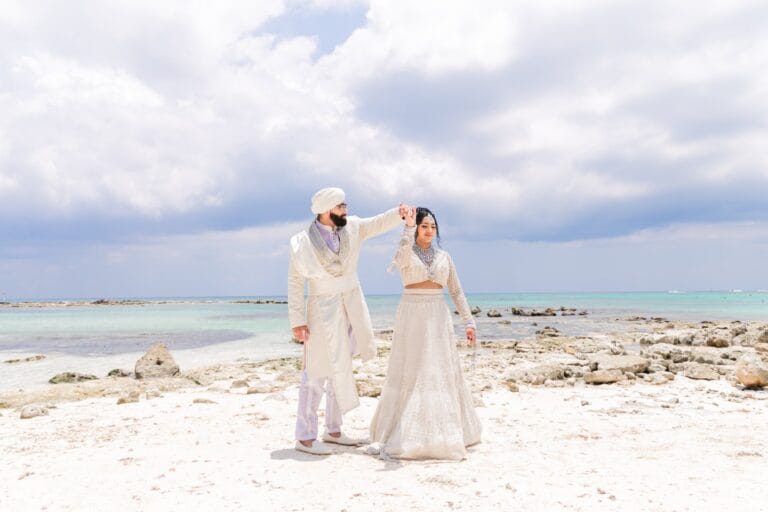 Nusaibah and Jai together beside the turquoise Caribbean Sea at Barcelo Riviera Maya.