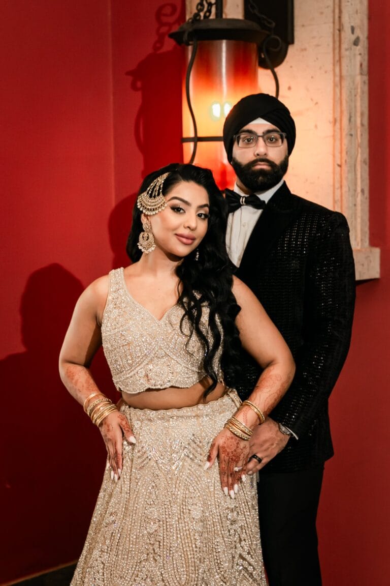 Portrait of Nusaibah and Jai in their evening wedding attire at Barcelo Riviera Maya.